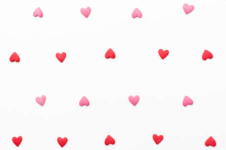 background of small red and pink hearts. Festive background for Valentine's day, birthday, wedding, holiday, postcard, partyの写真素材