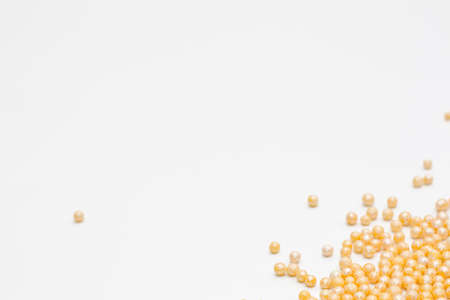 yellow sprinkles on a white background. Festive background for Valentine's day, birthday, holiday, partyの写真素材