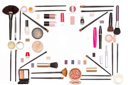cosmetic makeup: eye shadow, brushes, mascara, powder and other accessories for women on white...