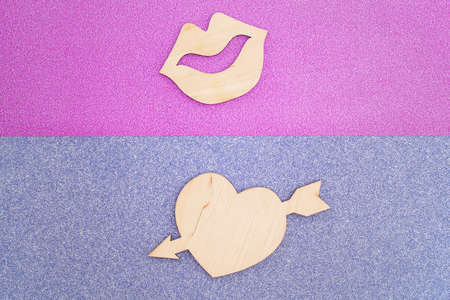 wooden female lips and heart on colorful background. romantic love background, flat lay.の写真素材