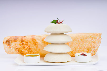 Ghee roast  Dosa and Idlii, south indian main breakfast item which is beautifully arranged in a...
