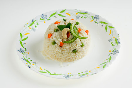 Upma made of samolina or rava upma, most famous south indian breakfast item which is beautifully...