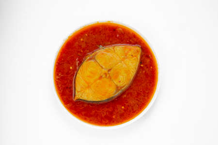Fish curry_ seer fish, traditional Indian fish curry ,kerala special ,arranged in a white bowl...