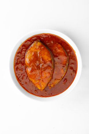 Fish curry_ seer fish, traditional Indian fish curry ,kerala special ,arranged in a white bowl...