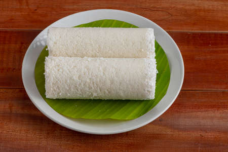 Puttu,steam cake ,white raw rice puttu , pacharisi maavu puttu _breakfast item made using rice flour...