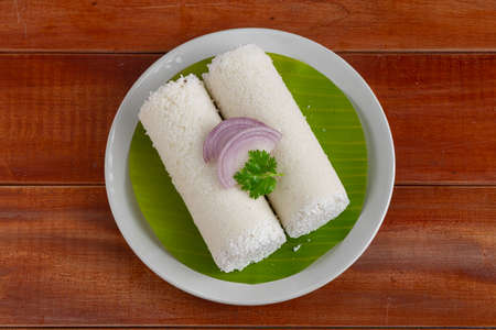 Puttu,steam cake ,white raw rice puttu , pacharisi maavu puttu _breakfast item made using rice flour...