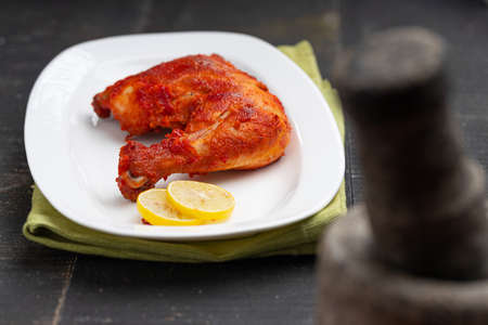 Fried chicken leg  or drum stick fry, spicy indian chicken fry with black  background,selective focusの写真素材