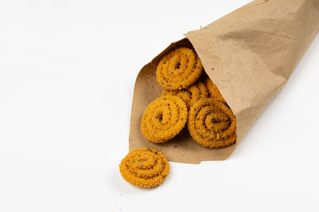 MURUKKU, Kerala  special snack made using rice flour, isolated image arranged in white background.の写真素材
