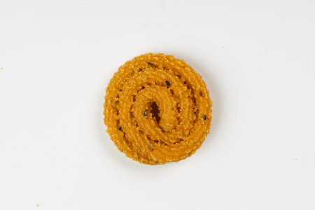 MURUKKU, Kerala  special snack made using rice flour, isolated image arranged in white background.の写真素材