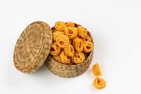 MURUKKU, Small spiral murukku which is very spicy and tasty, isolated images with white background.の写真素材