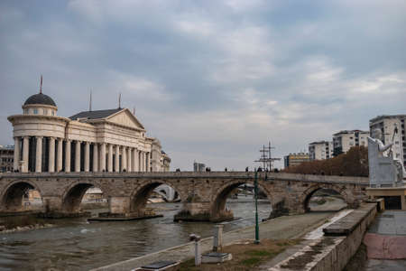 Skopje - North Macedonia - December 2018: View of Stone bridge and the Archaeological Museum of Macedoniaのeditorial素材