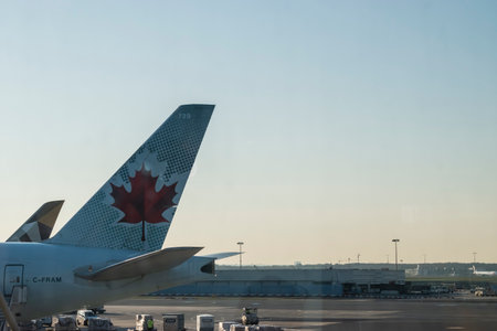 Frankfurt, Germany - April 2019: Air Canada plane boarding at Terminal 1 at Frankfurt INTL Airport (FRA).のeditorial素材