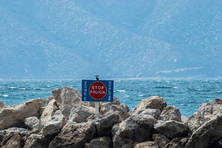 Radhime, Vlore, Albania - April 2019: Prohibited police area sign, used from the Albania and Italian police to dock boats used to patrol Albanian territorial waters for criminals and drug dealers.のeditorial素材