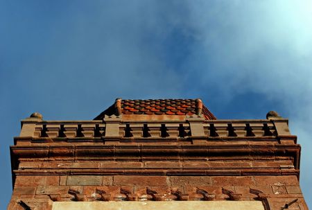 Castle tower in Italy with the cloudy sky in the backgroundの写真素材