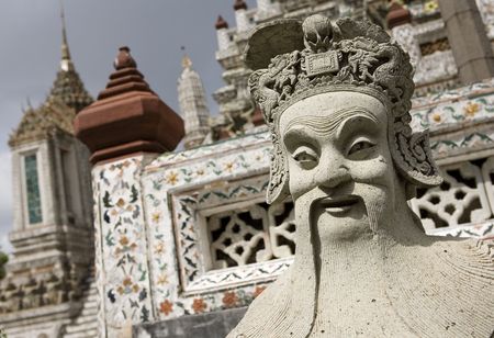 Statue of a man in Wat Arun - Temple of the Dawn in Bangkok / Thailandの写真素材