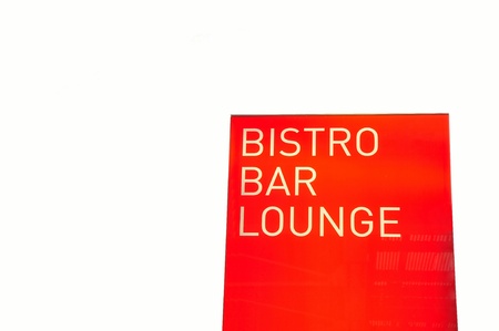 Signboard Bistro Bar Lounge - red background, Cologne Germany. Isolated on white.の写真素材