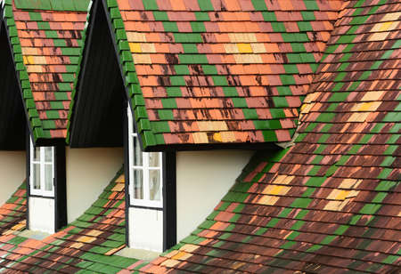 Dormer windows on tiles roofの写真素材