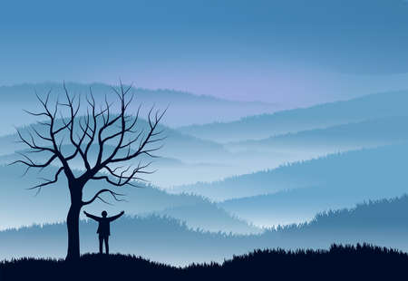 Nature landscape with mountains shrouded in fog. In the foreground the silhouettes of a person next...