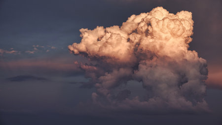 Dramatic sky with stormy cumulus clouds.の写真素材