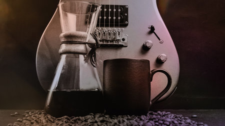 A coffee brewing jug, a red electric guitar, a black coffee mug and coffee beans on black background. Vintage music and coffee concept.の写真素材