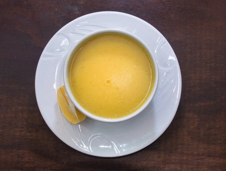 Traditional Turkish, Asian, red lentil soup served with a slice of lemon, pita bread. ramadan starter menu. top viewの写真素材