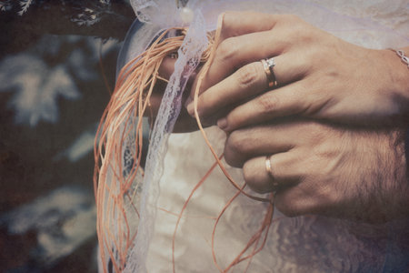 Wedding day. Hands of the bride and groom with ringsの写真素材