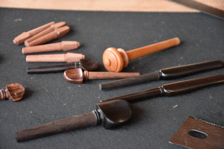 Table of tools for making Violin model. Workbench with tools for making wooden musical instruments.