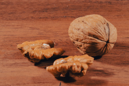 Walnuts on a wooden background. Selective focus. Toned.