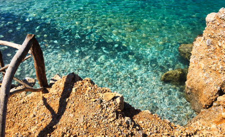 Rocks and pebbles on the coast of the island of Cyprusの写真素材