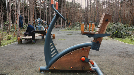 Outdoor exercise equipment in the park, sport and healthy lifestyle concept