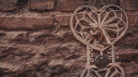 Dreamcatcher on a stone wall background. Boho style.の写真素材
