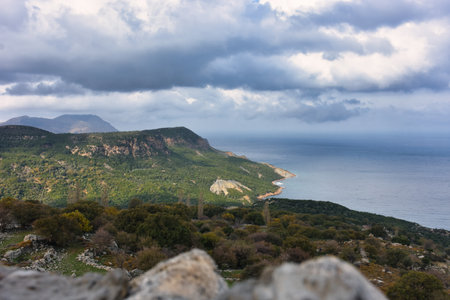 Cinaralti location in Tepekoy, a Greek village in GokÃ§eada, Imbros the magnificent Aegean Sea, the view of the mountains and cloud clustersの写真素材