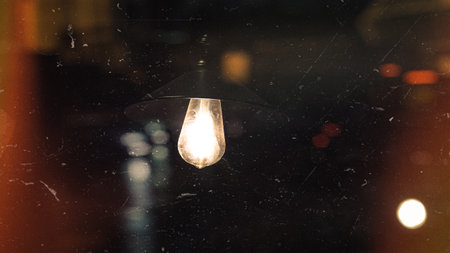 Vintage light bulb on a black background. Selective focus.の写真素材