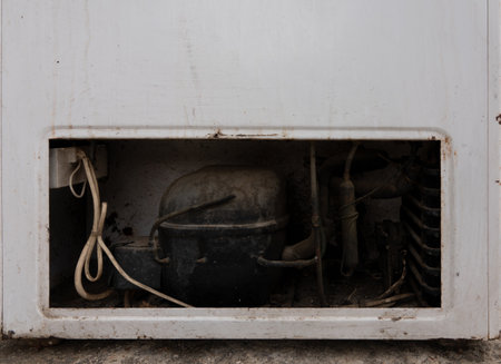 Old rusty freezer engine, close-up view.の写真素材