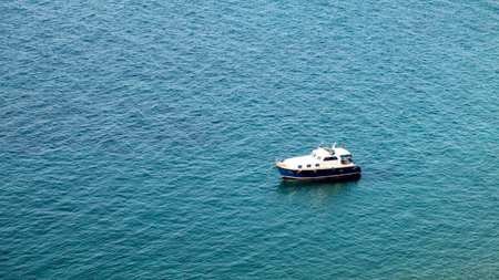 Gokceada, Canakkale, Turkey July 2,2023: An excursion boat anchored in Blue Bay (Mavi Bay), one of the most beautiful bays of Gokceada. Imbros islandのeditorial素材