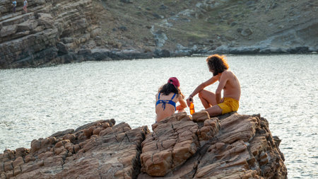 GÃ¶kÃ§eada, Ãanakkale, Turkey July 2, 2023: People enjoying Yildizkoy public beach located at the north of GÃ¶kÃ§eada (Imbros). The bay is under protection in national sea park status.のeditorial素材