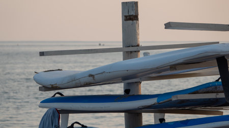Surfboards on the beach in the evening. Selective focus.