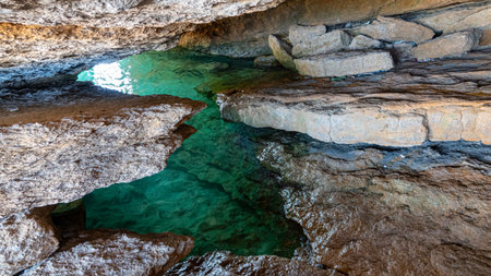 sea cave in Hidden 'Liman' beach in GÃ¶kÃ§eada Ugurlu location. Turkeyの写真素材