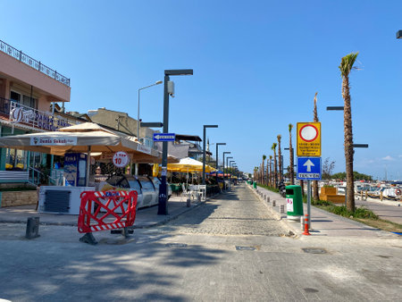 Urla, Izmir, Turkey - Sept 10, 2023: Street view and old style buildings, caffee shops and bars in narrow streets of Urla. Urla is a popular tourist attraction in Izmir, Turkey.のeditorial素材