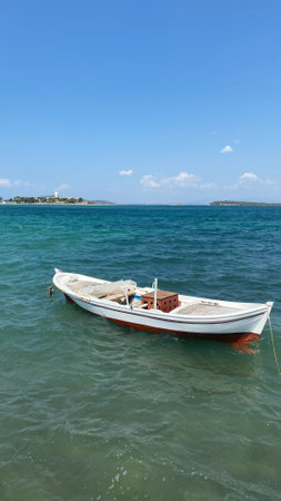 Small fishing boat in the cost of Aegean sea in Urla, Izmir, Turkeyの写真素材