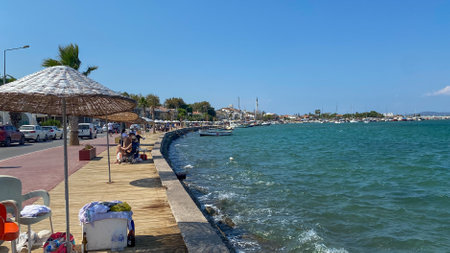 Urla, Izmir, Turkey - Sept 10, 2023: Street view and old style buildings, caffee shops and bars in...