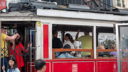 Istanbul-Turkey: Sep.20, 2023: Tourists and local people traveling by historical red tramway. Taksim is one of the most popular tourist destinations in Istanbulのeditorial素材
