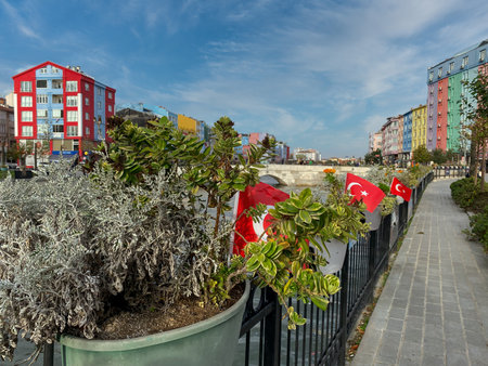 Silivri, Istanbul, Turkey November 6, 2023 Pedestrian bridge view with Colorful houses and Turkish flags on the river in Silivri. Silivri is a touristic seaside resort of Istanbulのeditorial素材
