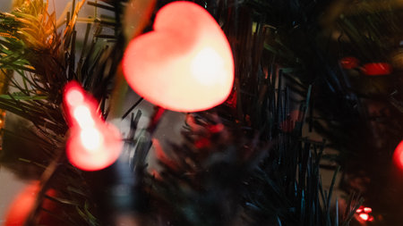 Heart shaped lights on a christmas tree, shallow depth of fieldの写真素材