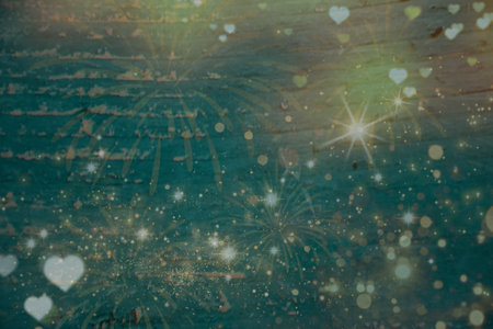 Shining Christmas golden lights, glowing heart shapes with bokeh particles on wooden vintage background, club party holiday copy space. Copy space for your text and pictures.の写真素材