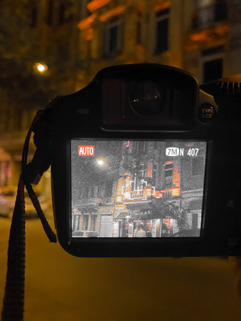 Screen of an old dslr camera in the street at night in Taksim, Istanbul. the artist shoots old...