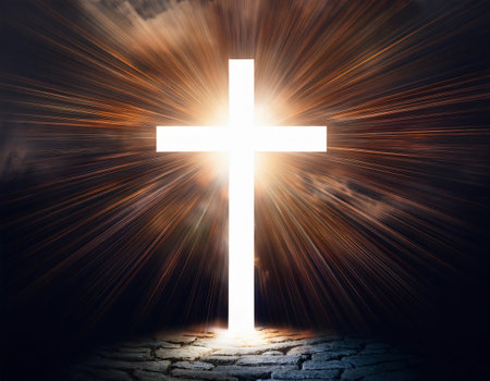 Cross glowing in the dark with rays of light coming out of the darknessの素材