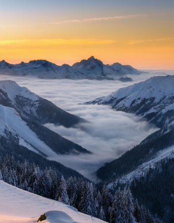 Beautiful winter landscape in the Alps. Sunrise over the clouds.の素材