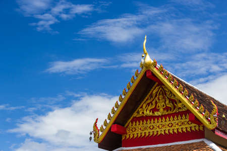 Thai art on roof at Thai templeの写真素材