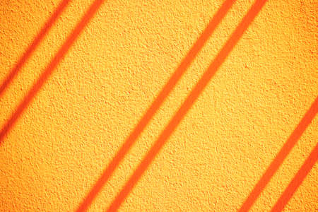 Concrete wall texture. Orange tone.の写真素材
